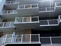 <b>White Aluminum Balcony Railing on the back side of Ocean Waves in Ocean City MD</b>